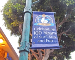 Seal Beach Centennial banners fly up into position