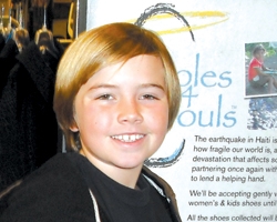 Cub Scout collects shoes for Haiti victims