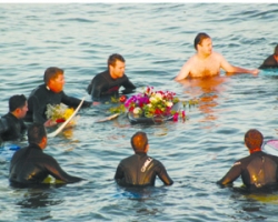 Surfers say farewell to a friend